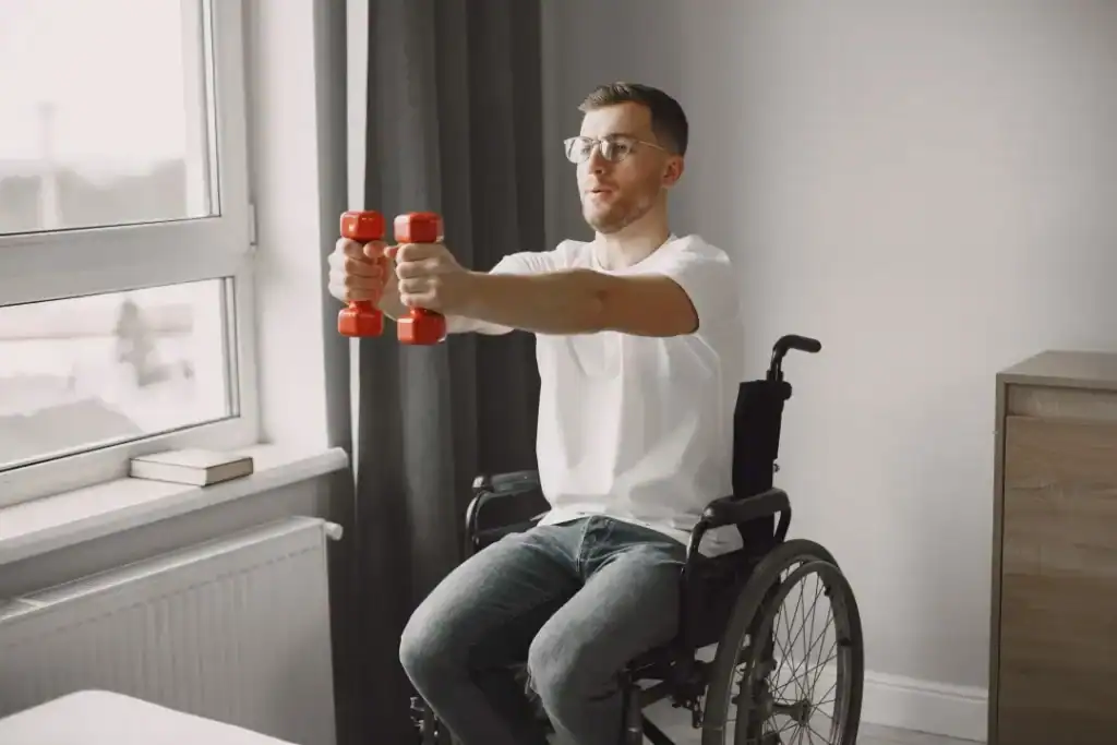 Image of man doing exercise in his wheelchair to aid weight loss Loughborough