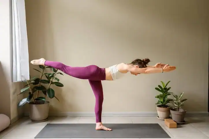 Achieving the Perfect Tone: How Often Should You Exercise for Results? 1 Woman doing Yoga exercise Loughborough to help with toning the body.