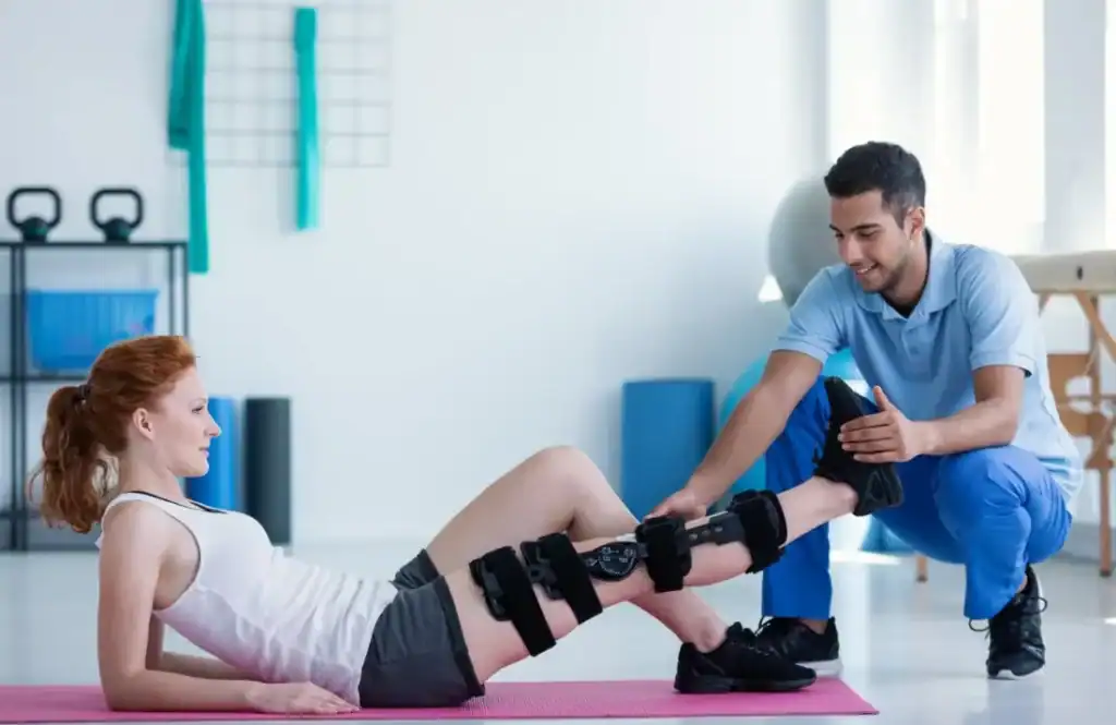 Woman having treatment to help muscle recovery Loughborough after an injury