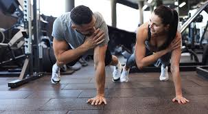 Image of man and woman doing Cardio Loughborough to tone their arms. 